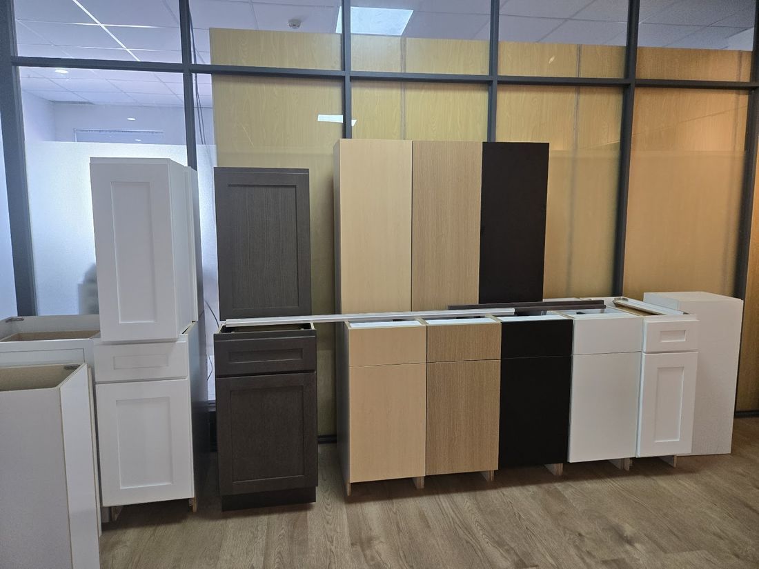 Builder-grade cabinet finish range from white shaker to matte black slab for multifamily packages