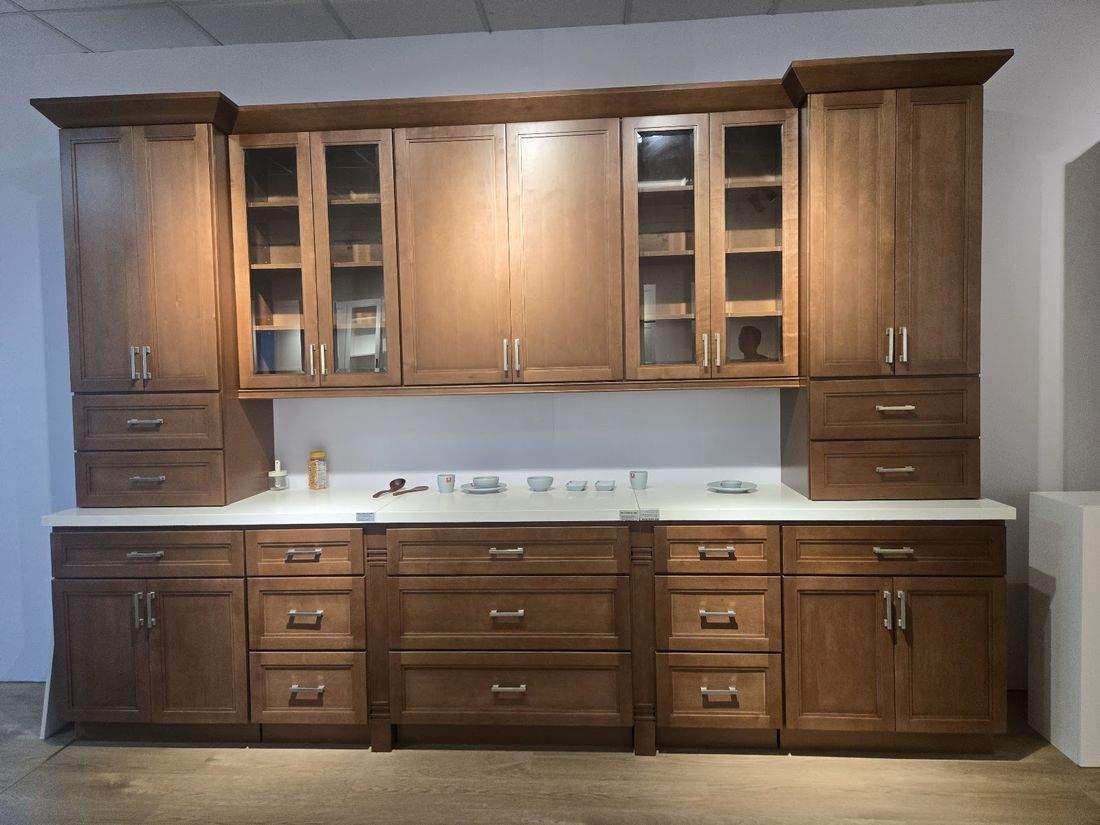 Warm wood shaker bath vanity cabinets with white stone countertop